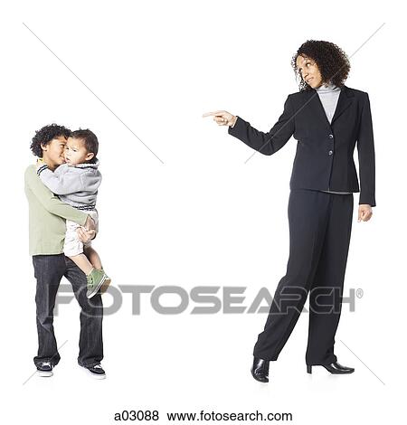 Studio shot of mother talking to sons (18-23 months, 8-9 years) View Large Photo Image Stock Photo - Studio shot of mother talking to sons (18-23 months, 8-9 years). Fotosearch
