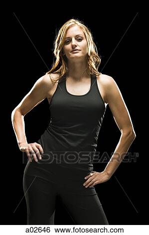 Studio shot of standing young woman View Large Photo Image Stock Photograph - Studio shot of standing young woman. Fotosearch