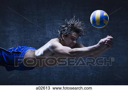 Studio shot of volleyball player playing View Large Photo Image Stock Image - Studio shot of volleyball player playing. Fotosearch