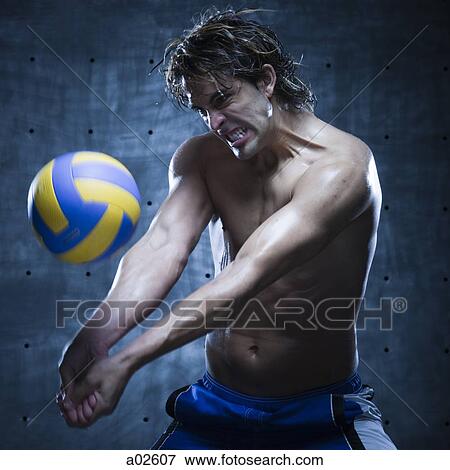 Studio shot of volleyball player playing View Large Photo Image Stock Photo - Studio shot of volleyball player playing. Fotosearch