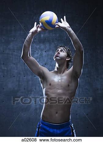 Stock Photo - Studio shot of volleyball player playing. Fotosearch
