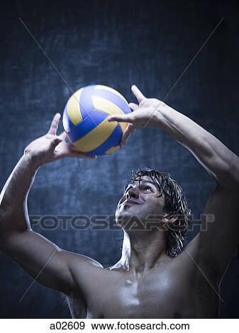 Studio shot of volleyball player playing View Large Photo Image Stock Photo - Studio shot of volleyball player playing. Fotosearch
