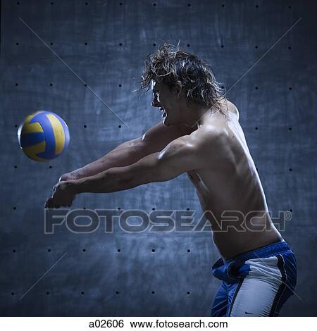 Studio shot of volleyball player playing View Large Photo Image Stock Photograph - Studio shot of volleyball player playing. Fotosearch