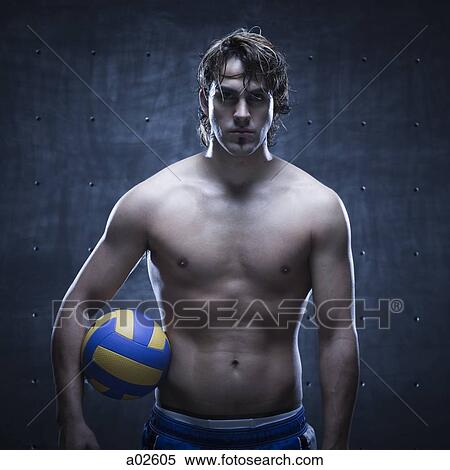 Studio shot of volleyball player standing and holding ball View Large Photo Image Stock Photography - Studio shot of volleyball player standing and holding ball. Fotosearch