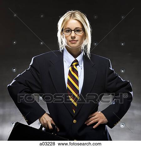 Successful businesswoman holding suitcase, portrait View Large Photo Image Stock Photo - Successful businesswoman holding suitcase, portrait. Fotosearch