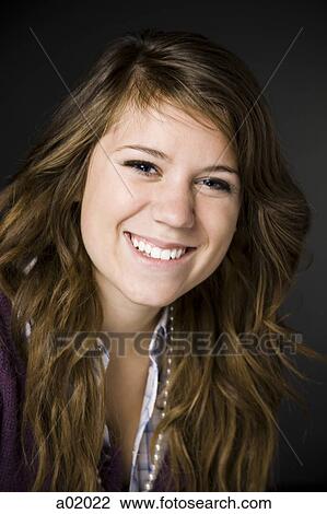 Successful teenage girl (16-17) smiling, portrait, close-up View Large Photo Image Stock Image - Successful teenage girl (16-17) smiling, portrait, close-up. Fotosearch