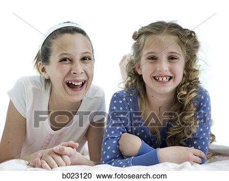 two girls in a bedroom View Large Photo Image Stock Image - two girls in a bedroom. Fotosearch