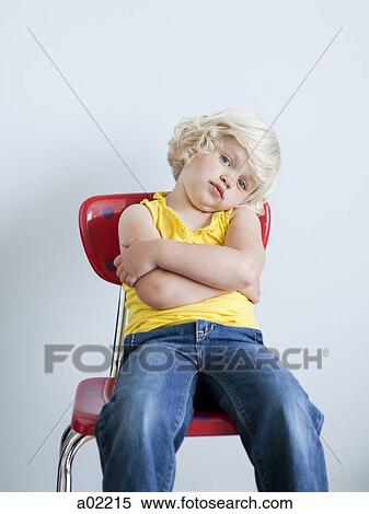 Upset girl (2-3) sitting on chair, studio shot View Large Photo Image Stock Photography - Upset girl (2-3) sitting on chair, studio shot. Fotosearch