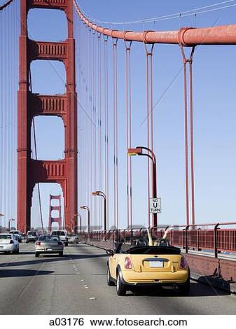 Stock Photograph - USA, California, San Francisco, cars on Golden Gate Bridge. Fotosearch