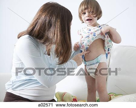 USA, California, San Francisco, girl (2-3) with mother touching her belly View Large Photo Image Stock Image - USA, California, San Francisco, girl (2-3) with mother touching her belly. Fotosearch