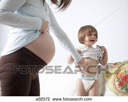 USA, California, San Francisco, girl (2-3) with mother touching her belly View Large Photo Image Stock Image - USA, California, San Francisco, girl (2-3) with mother touching her belly. Fotosearch