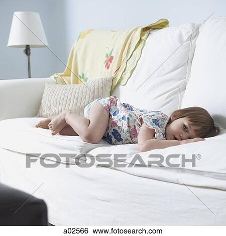 USA, California, San Francisco, girl (2-3) lying on sofa View Large Photo Image Stock Photograph - USA, California, San Francisco, girl (2-3) lying on sofa. Fotosearch