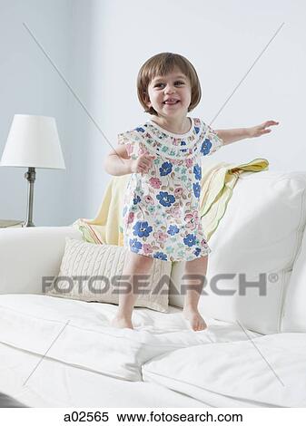 USA, California, San Francisco, girl (2-3) walking on sofa View Large Photo Image Stock Photography - USA, California, San Francisco, girl (2-3) walking on sofa. Fotosearch