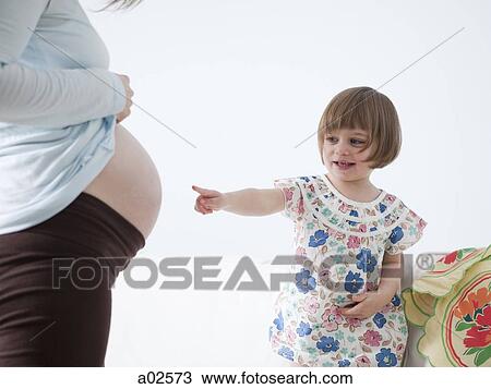 USA, California, San Francisco, little girl (2-3) touching pregnant mother's belly View Large Photo Image Stock Image - USA, California, San Francisco, little girl (2-3) touching pregnant mother's belly. Fotosearch