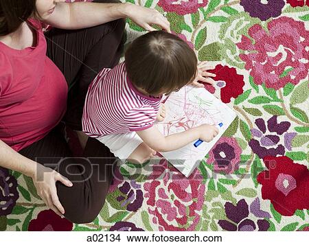 Picture - USA, California, San Francisco, pregnant mother with daughter (2-3) coloring. Fotosearch