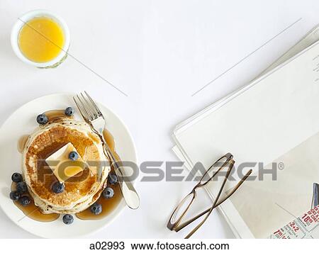 USA, California, San Francisco, blueberry pancakes with eyeglasses and juice on table, overhead view View Large Photo Image Stock Image - USA, California, San Francisco, blueberry pancakes with eyeglasses and juice on table, overhead view. Fotosearch