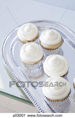 USA, California, San Francisco, cupcakes with frosting on silver plate View Large Photo Image Stock Photo - USA, California, San Francisco, cupcakes with frosting on silver plate. Fotosearch