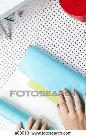USA, California, San Francisco, young woman wrapping gift View Large Photo Image Stock Image - USA, California, San Francisco, young woman wrapping gift. Fotosearch