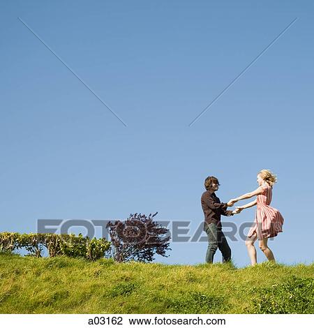 USA, California, San Francisco, young couple holding hands on hill View Large Photo Image Stock Image - USA, California, San Francisco, young couple holding hands on hill. Fotosearch