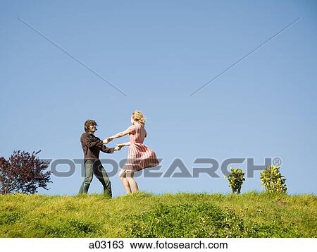 USA, California, San Francisco, young couple holding hands on hill View Large Photo Image Stock Image - USA, California, San Francisco, young couple holding hands on hill. Fotosearch