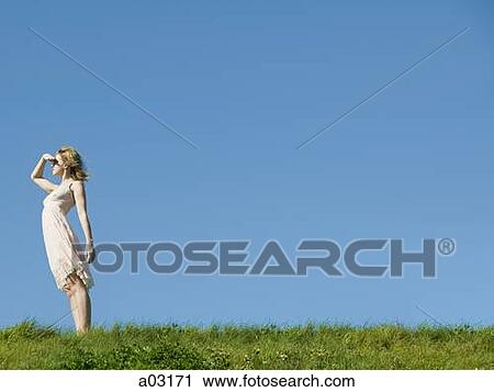 USA, California, San Francisco, young woman shielding face while looking at view View Large Photo Image Stock Image - USA, California, San Francisco, young woman shielding face while looking at view. Fotosearch