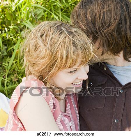 USA, California, San Francisco, young couple embracing, close-up View Large Photo Image Stock Photo - USA, California, San Francisco, young couple embracing, close-up. Fotosearch
