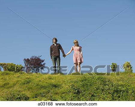 USA, California, San Francisco, young couple holding hands on hill View Large Photo Image Stock Photo - USA, California, San Francisco, young couple holding hands on hill. Fotosearch