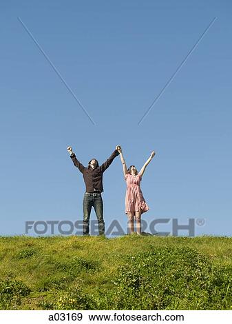 USA, California, San Francisco, young couple holding hands on hill View Large Photo Image Stock Photo - USA, California, San Francisco, young couple holding hands on hill. Fotosearch