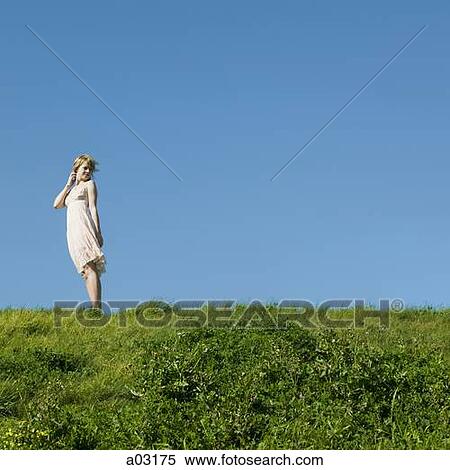 USA, California, San Francisco, young woman standing on grass View Large Photo Image Stock Photography - USA, California, San Francisco, young woman standing on grass. Fotosearch