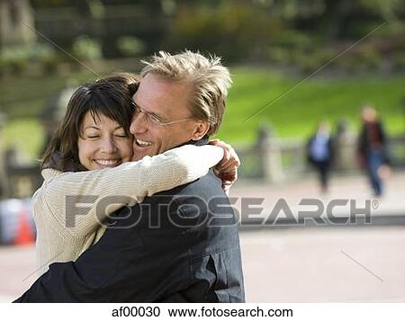 USA, New York City, Manhattan, Central Park, Mature couple embracing in Central Park View Large Photo Image Stock Image - USA, New York City, Manhattan, Central Park, Mature couple embracing in Central Park. Fotosearch