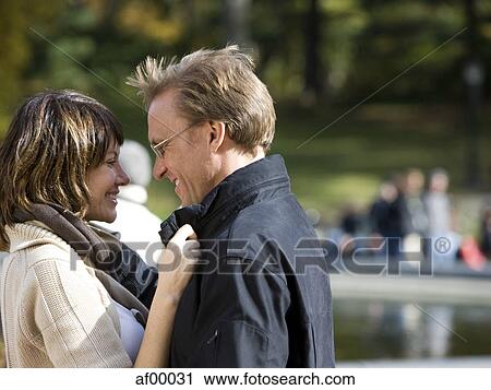USA, New York City, Manhattan, Central Park, Mature couple embracing in Central Park View Large Photo Image Stock Image - USA, New York City, Manhattan, Central Park, Mature couple embracing in Central Park. Fotosearch