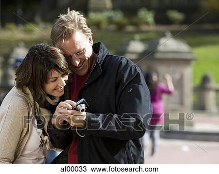 USA, New York City, Manhattan, Central Park, Mature couple watching camera in Central Park View Large Photo Image Stock Image - USA, New York City, Manhattan, Central Park, Mature couple watching camera in Central Park. Fotosearch