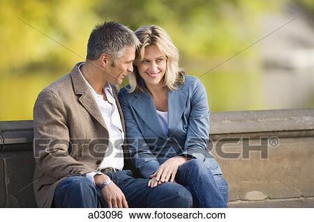 USA, New York, New York City, couple sitting in park View Large Photo Image Stock Photograph - USA, New York, New York City, couple sitting in park. Fotosearch