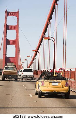 Stock Photo - USA, San Francisco, California, Traffic moving on Golden Gate Bridge. Fotosearch
