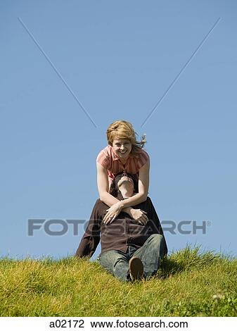 USA, San Francisco, California, young couple embracing on grassy hill View Large Photo Image Stock Image - USA, San Francisco, California, young couple embracing on grassy hill. Fotosearch