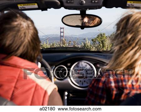 USA, San Francisco, California, young couple sitting in convertible car and looking at Golden Gate Bridge in distance View Large Photo Image Stock Image - USA, San Francisco, California, young couple sitting in convertible car and looking at Golden Gate Bridge in distance. Fotosearch