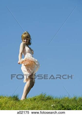 USA, San Francisco, California, young woman dancing on grassy hill View Large Photo Image Stock Photography - USA, San Francisco, California, young woman dancing on grassy hill. Fotosearch