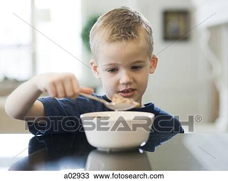 USA, Utah, Alpine, boy (6-7) eating cereals by table View Large Photo Image Stock Image - USA, Utah, Alpine, boy (6-7) eating cereals by table. Fotosearch