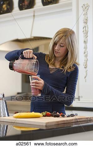 USA, Utah, Alpine, girl (12-13) pouring fruit cocktail from pitcher to glass View Large Photo Image Stock Image - USA, Utah, Alpine, girl (12-13) pouring fruit cocktail from pitcher to glass. Fotosearch