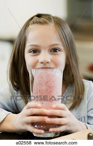 USA, Utah, Alpine, girl (8-9) holding a glass of fruit cocktail in her hands View Large Photo Image Stock Photo - USA, Utah, Alpine, girl (8-9) holding a glass of fruit cocktail in her hands. Fotosearch