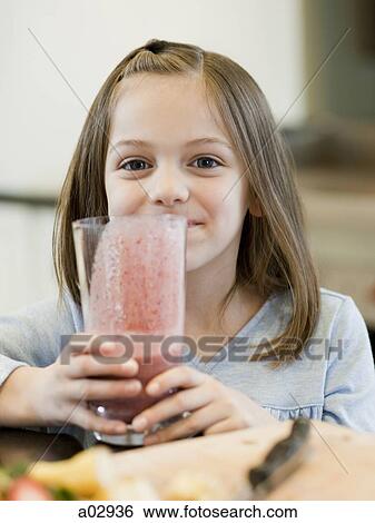 USA, Utah, Alpine, girl (8-9) holding smoothie View Large Photo Image Stock Photograph - USA, Utah, Alpine, girl (8-9) holding smoothie. Fotosearch