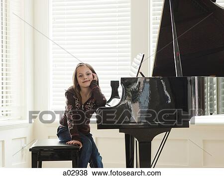 USA, Utah, Alpine, girl (8-9) leaning to piano View Large Photo Image Stock Photo - USA, Utah, Alpine, girl (8-9) leaning to piano. Fotosearch