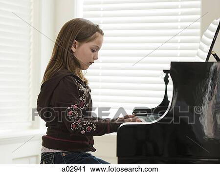 USA, Utah, Alpine, girl (8-9) practicing piano, side view View Large Photo Image Stock Image - USA, Utah, Alpine, girl (8-9) practicing piano, side view. Fotosearch