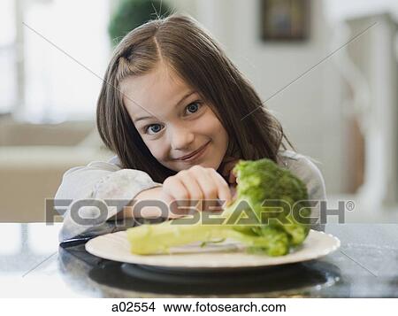 USA, Utah, Alpine, happy girl (8-9) with meal View Large Photo Image Picture - USA, Utah, Alpine, happy girl (8-9) with meal. Fotosearch