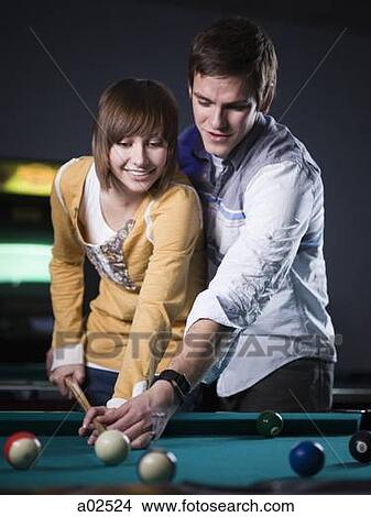 USA, Utah, American Fork, young couple playing pool View Large Photo Image Picture - USA, Utah, American Fork, young couple playing pool. Fotosearch