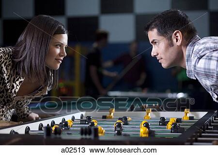 USA, Utah, American Fork, young couple playing table football View Large Photo Image Stock Image - USA, Utah, American Fork, young couple playing table football. Fotosearch