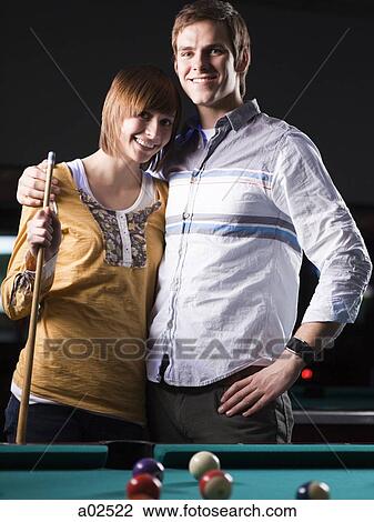 USA, Utah, American Fork, young couple standing behind pool table View Large Photo Image Stock Image - USA, Utah, American Fork, young couple standing behind pool table. Fotosearch