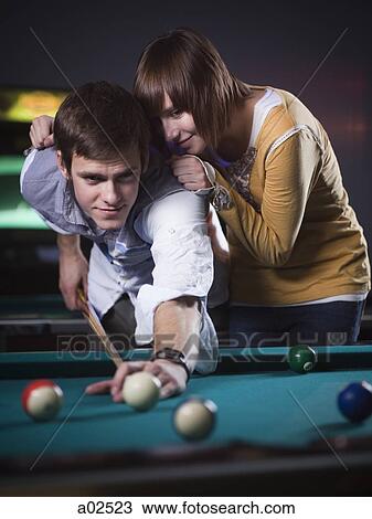 USA, Utah, American Fork, young couple playing pool View Large Photo Image Stock Image - USA, Utah, American Fork, young couple playing pool. Fotosearch