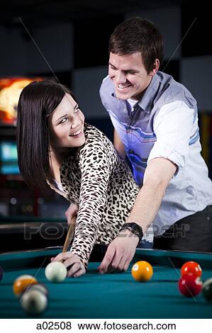 USA, Utah, American Fork, young couple playing pool View Large Photo Image Stock Photo - USA, Utah, American Fork, young couple playing pool. Fotosearch