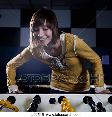 USA, Utah, American Fork, young woman playing table football View Large Photo Image Stock Photography - USA, Utah, American Fork, young woman playing table football. Fotosearch